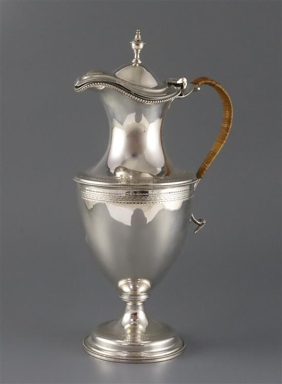 A late Victorian silver claret/hot water jug by Hawksworth, Eyre & Co, gross 29.5 oz.